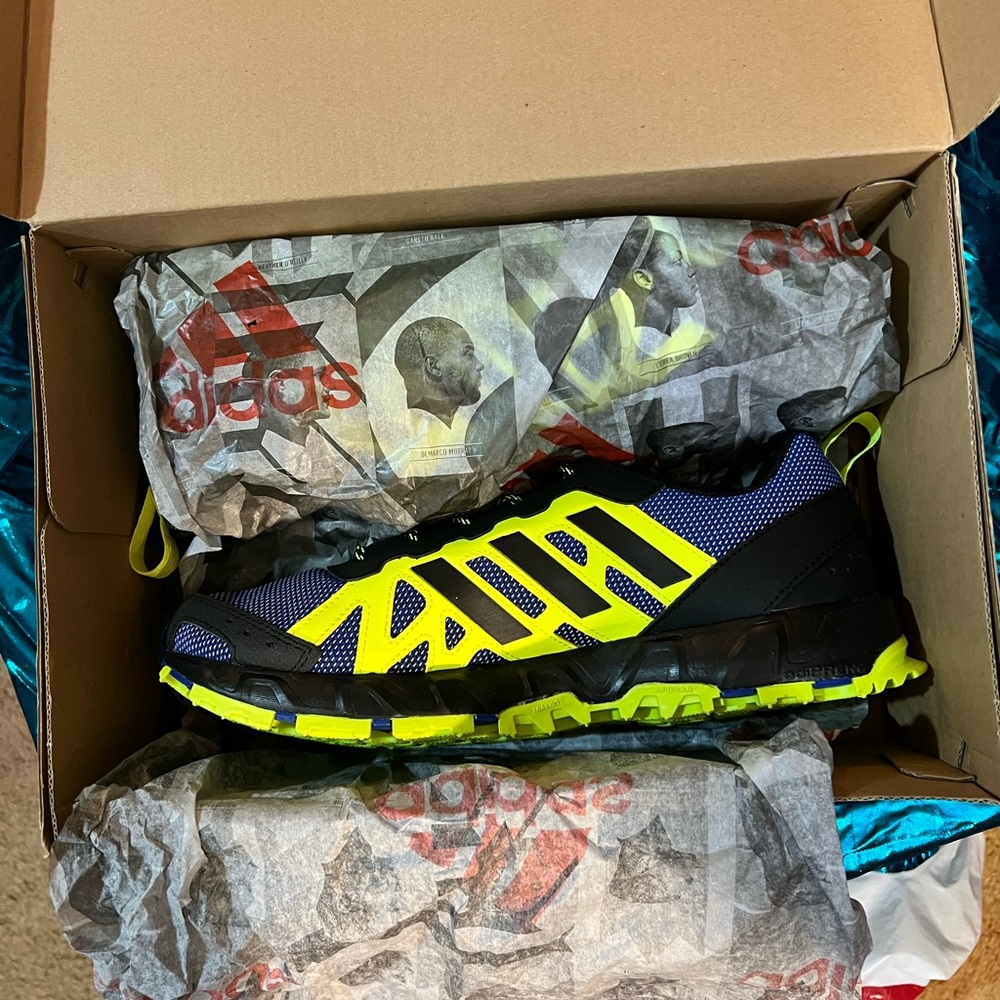 Adidas blue and green running shoes. New and never been worn.